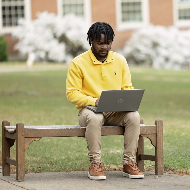 student on bench