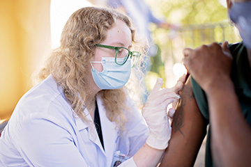 Pharmacy student administering vaccine at Trinity Methodist