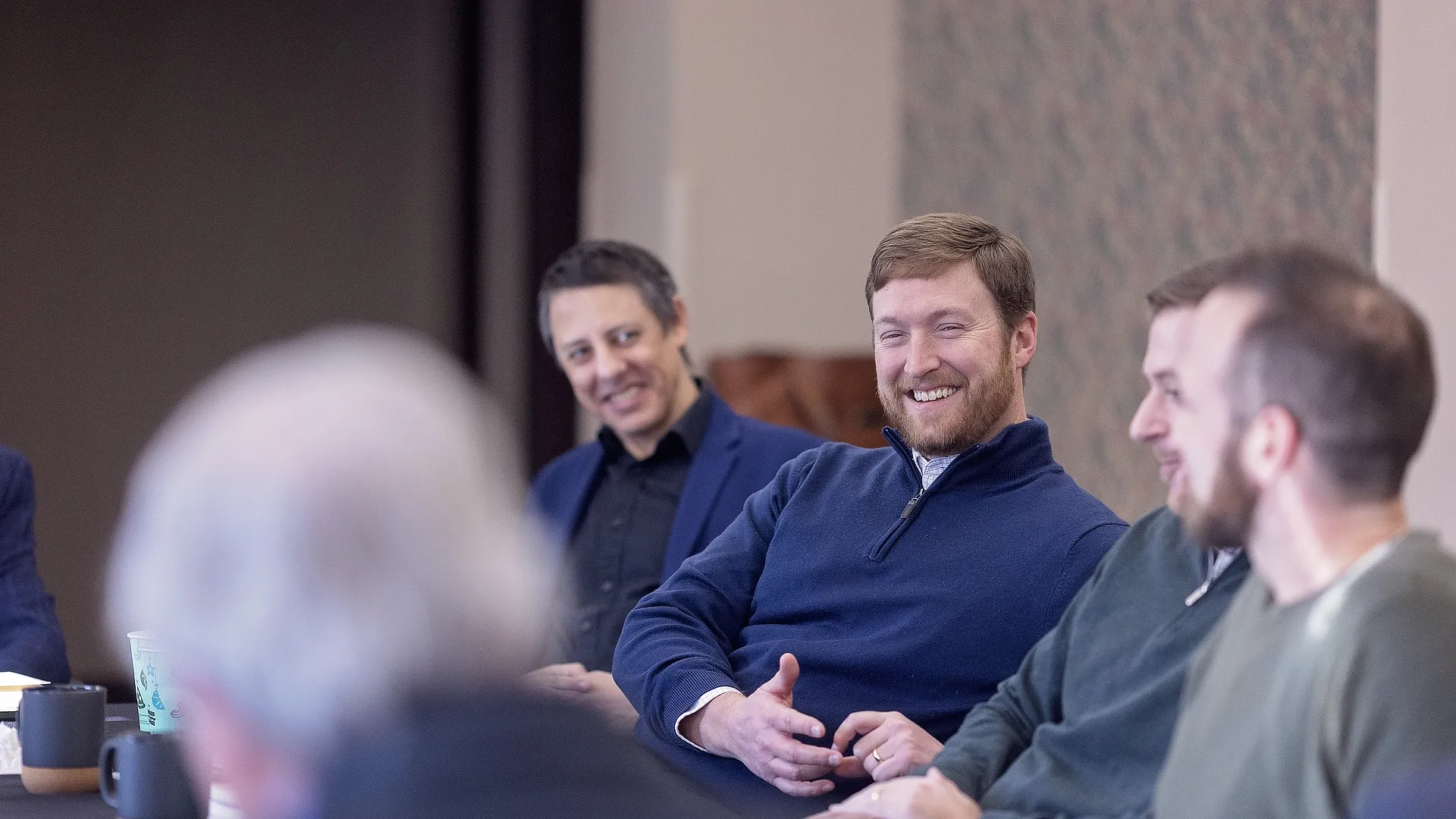 phd students sitting at a table