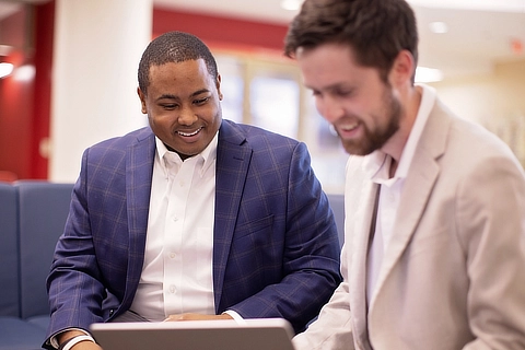 business students looking at laptop DR04032023529 cta