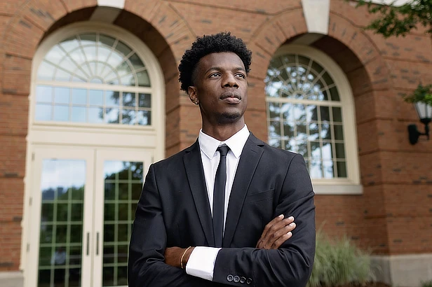 male business student standing outside