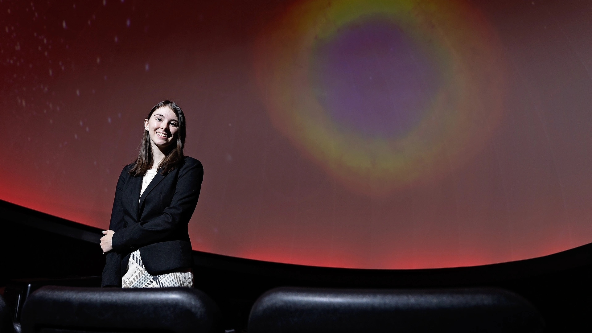 female student in the Christenberry Planetarium