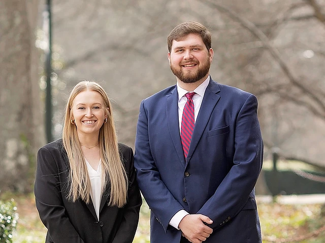 male and female law student standing outside