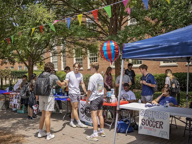 samford students at soccer club tent